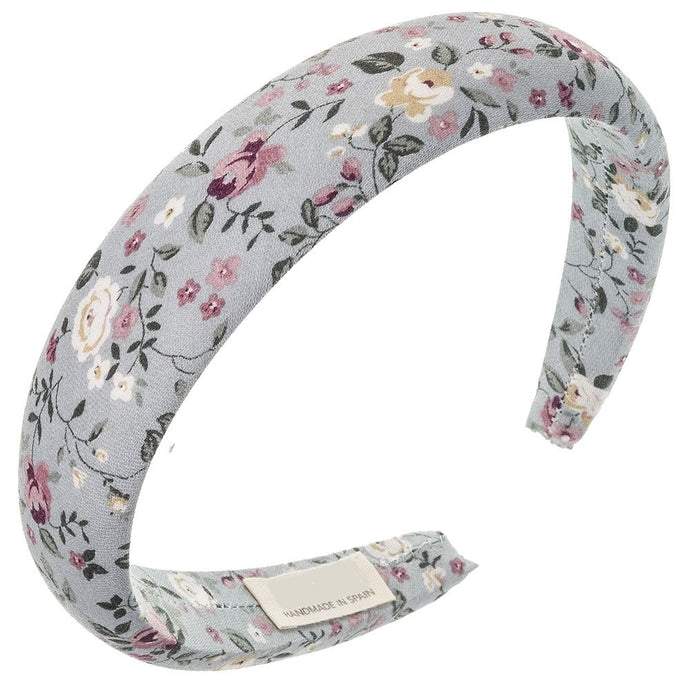 Lovely floral padded hairband. Beautifully handmade in Spain with extreme attention to detail. Suitable for girls or woman! Width 3 cm. Stunning and delicate floral print in a light blue fabric will add the final touch to any outfit! Olivia Ann