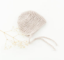 This cosy bonnet is hand knitted in Europe, specially designed for the 34 cm dolls, but can fit dolls around 32 - 38 cm (12 - 15 inch) Miniland, Minikane, Paola Reina Gordis and similar.