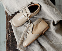 Beautiful smart-casual style lace-up ankle boots with a lovely tassel detail. Made with an adorable combination of Beige Patent Leather and Suede of the highest quality. Olivia Ann Shoes.