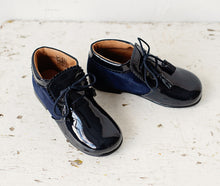 Beautiful smart-casual style lace-up ankle boots with a lovely tassel detail. Made with an adorable combination of Navy Patent Leather and Suede of the highest quality. Olivia Ann Shoes.