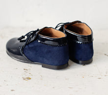 Beautiful smart-casual style lace-up ankle boots with a lovely tassel detail. Made with an adorable combination of Navy Patent Leather and Suede of the highest quality. Olivia Ann Shoes.