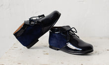 Beautiful smart-casual style lace-up ankle boots with a lovely tassel detail. Made with an adorable combination of Navy Patent Leather and Suede of the highest quality. Olivia Ann Shoes.