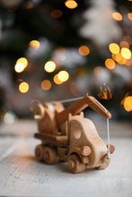 This gorgeous heirloom Wooden Crane is a must-have for any construction site lover.  Its clever design lets your child lift and lower construction materials, heavy pallets and boxes. Just like a real mobile construction crane.