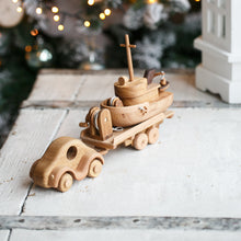 Wonderful set consisting of a beautifully detailed car with a tow trailer. You can use it as it is and add to the trailer whatever toy you want. Add our small boat or our Tug boat as they fit neatly on the back of the transporter.