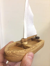 Cutest Heirloom Sailboat with a striped sail. This sailboat is lightweight and floats well on water. The sail is made of natural cotton fabric (stripes or plain white).  We love that these beautifully designed and made boats are not only toys but make the most beautiful decor for kids’ rooms too! Buy our Toy Truck where the sailboat is ideally positioned in the trailer, hours of fun!