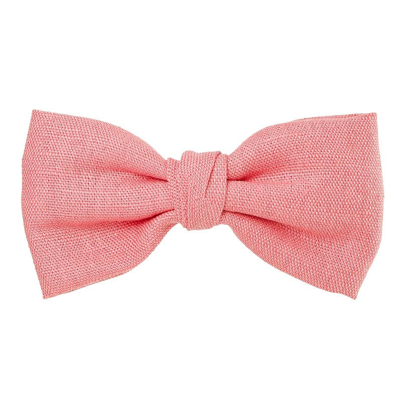 Beautiful and classic Linen bow in an alligator hair clip. This bow adds a perfect touch to any outfit! Handmade in Spain. Olivia Ann Wholesale Accessories.