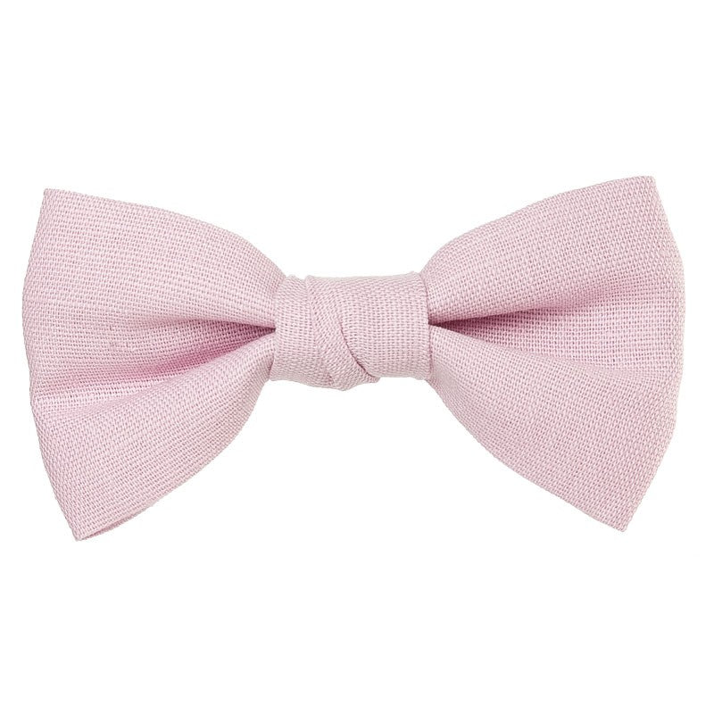 Beautiful and classic Linen bow in an alligator hair clip. This bow adds a perfect touch to any outfit! Timeless design a must have! Handmade in Spain. Olivia Ann Wholesale Accessories.
