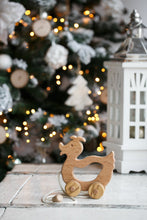 A walk-a long toy is the best toy for those who have already learned to walk. Is comfortable to hold by the smooth wooden handle. This sweet duck is made of solid beech.  Educational Montessori Toy.