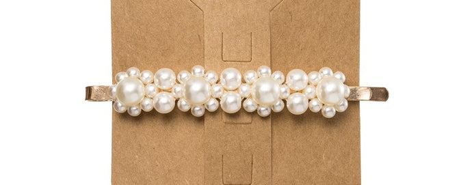 Floral faux pearl embellished hair clip, featuring faux pearl embellishments creating floral silhouettes.This trending Pearl Hair Clip