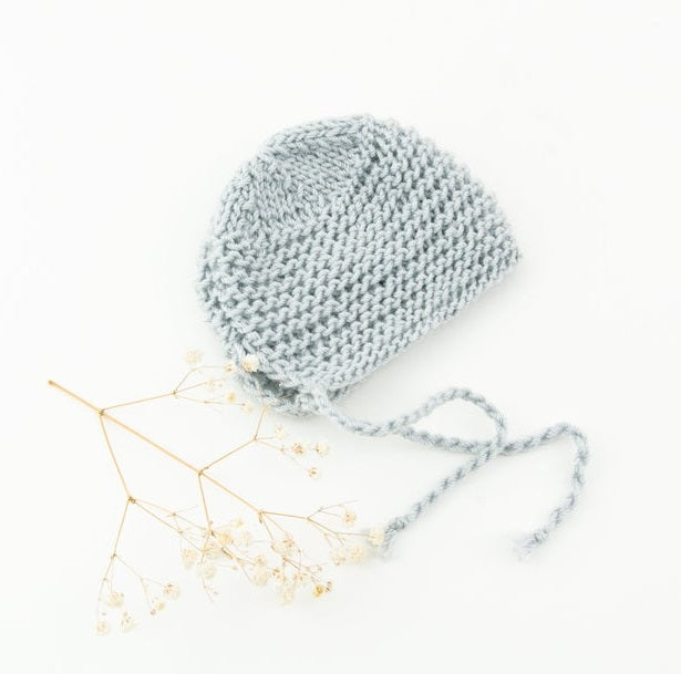 This cosy bonnet is hand knitted in Europe, specially designed for the 34 cm dolls, but can fit dolls around 32 - 38 cm (12 - 15 inch) Miniland, Minikane, Paola Reina Gordis and similar.