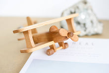 This beautiful wooden airplane is it is made of natural wood (oak and beech). Montessori organic toy. This original design plane is a perfect birthday gift idea for boys & girls or wooden toys collectors.