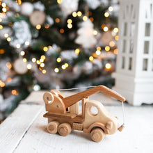 This gorgeous heirloom Wooden Crane is a must-have for any construction site lover.  Its clever design lets your child lift and lower construction materials, heavy pallets and boxes. Just like a real mobile construction crane.