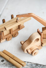 This gorgeous heirloom Wooden Crane is a must-have for any construction site lover.  Its clever design lets your child lift and lower construction materials, heavy pallets and boxes. Just like a real mobile construction crane.