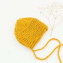 This cosy bonnet is hand knitted in Europe, specially designed for the 34 cm dolls, but can fit dolls around 32 - 38 cm (12 - 15 inch) Miniland, Minikane, Paola Reina Gordis and similar.