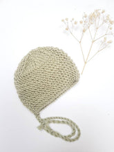 This cosy bonnet is hand knitted in Europe, specially designed for the 34 cm dolls, but can fit dolls around 32 - 38 cm (12 - 15 inch) Miniland, Minikane, Paola Reina Gordis and similar.