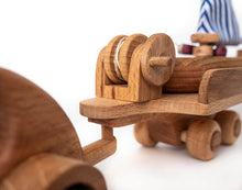 Wonderful set consisting of a beautifully detailed car with a tow trailer. You can use it as it is and add to the trailer whatever toy you want. Add our small boat or our Tug boat as they fit neatly on the back of the transporter.