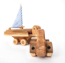 Wonderful set consisting of a beautifully detailed car with a tow trailer. You can use it as it is and add to the trailer whatever toy you want. Add our small boat or our Tug boat as they fit neatly on the back of the transporter.