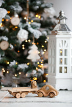 Wonderful set consisting of a beautifully detailed car with a tow trailer. You can use it as it is and add to the trailer whatever toy you want. Add our small boat or our Tug boat as they fit neatly on the back of the transporter.