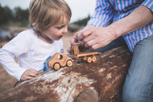 Wonderful set consisting of a beautifully detailed car with a tow trailer. You can use it as it is and add to the trailer whatever toy you want. Add our small boat or our Tug boat as they fit neatly on the back of the transporter.