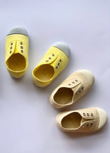 Our OLIVIA ANN soft canvas shoes have a new and improved material that is supersoft and comfortable, and perfect for speedy slip-ons when there's a game in the garden. Plimsoles, sneakers. Kids shoes. Lemon