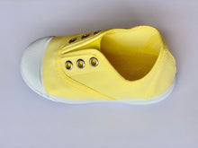Our OLIVIA ANN soft canvas shoes have a new and improved material that is supersoft and comfortable, and perfect for speedy slip-ons when there's a game in the garden. Plimsoles, sneakers. Kids shoes. Lemon