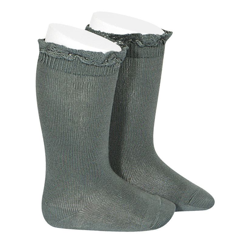 A very special  pair of socks, featuring an beautiful lace edging cuff in a delicate Lichen green colour.  Very good quality socks. Super soft. It will add a beautiful touch to any outfit! Condor lace socks