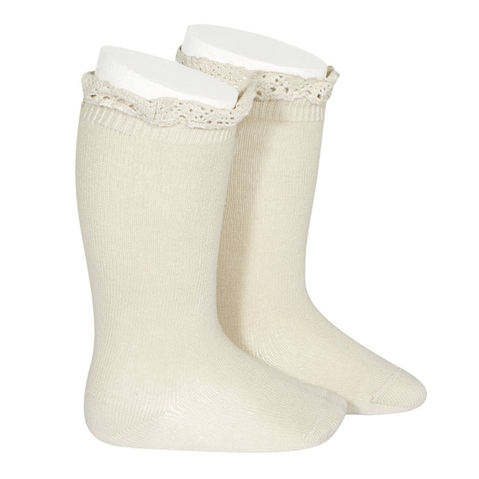 A very special  pair of socks, featuring an beautiful lace edging cuff in a delicate peach colour.  Very good quality socks. Super soft. It will add a beautiful touch to any outfit! Condor socks lace