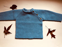 Sweet Unisex knitted Jumper with wooden buttons on the side in an adorable  blue colour. I must have basic piece!