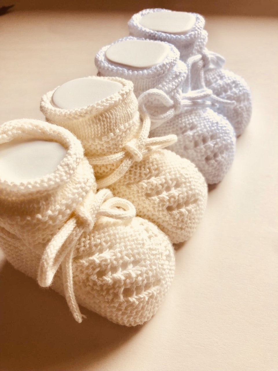Adorable Unisex Knitted Baby Booties. Available in White and Ecru. Made in Spain with love.