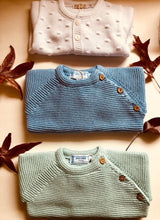 Sweet Unisex knitted Jumper with wooden buttons on the side in an adorable  blue colour. I must have basic piece!