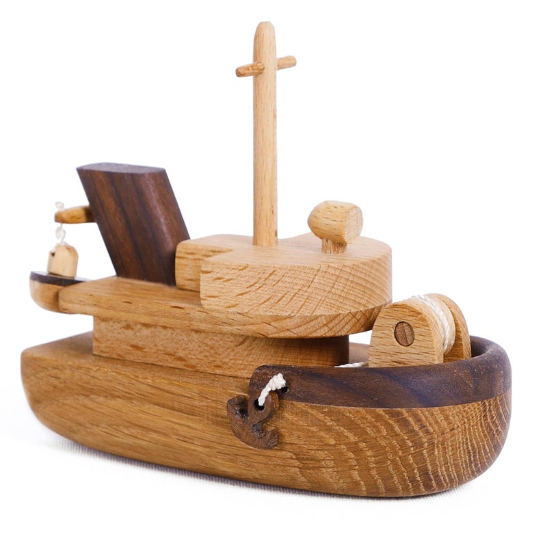 Cutest tugboat ever! The details are just amazing! This is not just a simple ship,it's a Tugboat, hours of fun!  We love that these beautifully designed and made toys are not only toys but make the most beautiful decor for kids’ rooms too!