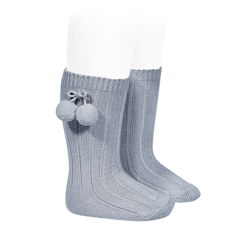 Beautiful and elegant Knee High Ribbed socks with Pom-Poms. An stunning addition to your little one's outfit! Fun and elegant. condor