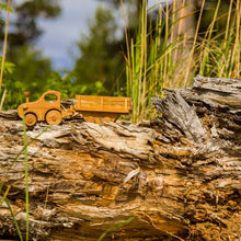 Adorable tractor with wooden log trailer. There is always plenty of work that needs to be done at the farm or the building site. Hitch the trailer to the tractor, load up the logs or animals and move them to a new place. Unhitch the trailer and the Farmer can drive the tractor around the farm or town.