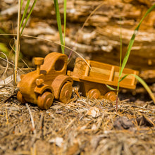Adorable tractor with wooden log trailer. There is always plenty of work that needs to be done at the farm or the building site. Hitch the trailer to the tractor, load up the logs or animals and move them to a new place. Unhitch the trailer and the Farmer can drive the tractor around the farm or town.