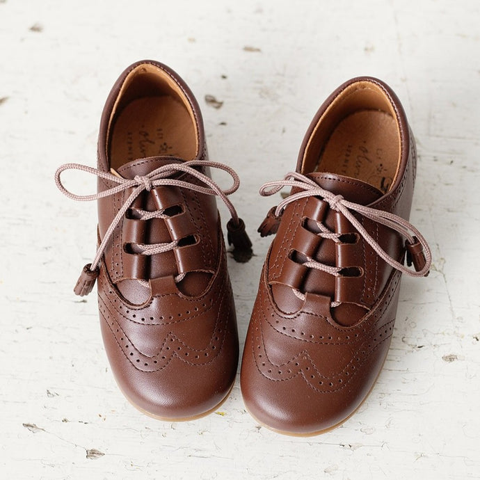 Beautiful smart-casual style lace-up brogue shoes. Made in an classic tan leather with contrast cream laces and a lovely tassel detail. Olivia Ann Shoes