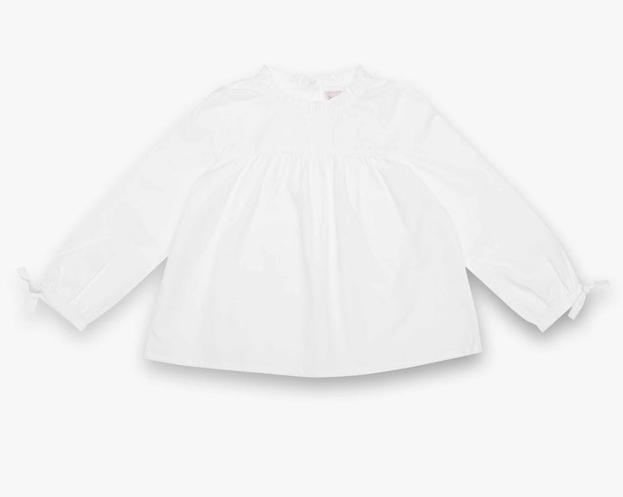 A twist of the Classic White Shirt. This lovely blouse has been designed with sophisticated ruffle around the neckline. Button fastening at the back.