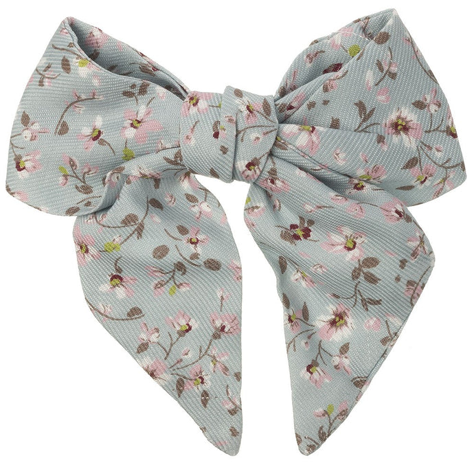 Beautiful hair bow in a delicate blue floral pattern, a unique handmade piece! snap hair clip. This bow adds a perfect touch to any outfit!