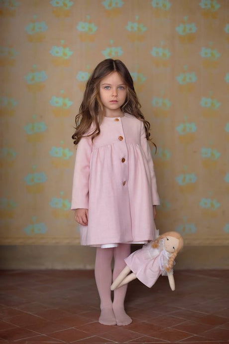 Stunning pink wool coat in a delicate pattern with side pockets. Ecru colour with pink dots lining fabric. Flared shape. 