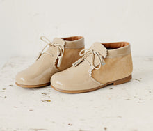 Beautiful smart-casual style lace-up ankle boots with a lovely tassel detail. Made with an adorable combination of Beige Patent Leather and Suede of the highest quality. Olivia Ann Shoes.