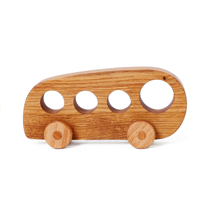 Simple yet stylish wooden toy bus. This simple design makes them super durable. They will not break even if they start knocking or throwing. There are four windows in the body which are very easy to grasp. 