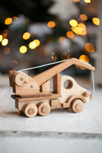 This gorgeous heirloom Wooden Crane is a must-have for any construction site lover.  Its clever design lets your child lift and lower construction materials, heavy pallets and boxes. Just like a real mobile construction crane. 