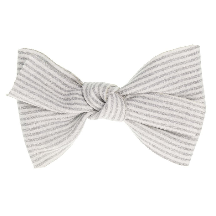 Beautiful hair bow in a delicate light grey cotton stripes pattern, a unique handmade piece! Approximately 11.5 x 9 cm long and secured to 5.5 cm snap hair clip.