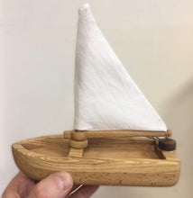 Cutest Heirloom Sailboat with a striped sail. This sailboat is lightweight and floats well on water. The sail is made of natural cotton fabric (stripes or plain white).  We love that these beautifully designed and made boats are not only toys but make the most beautiful decor for kids’ rooms too! Buy our Toy Truck where the sailboat is ideally positioned in the trailer, hours of fun!