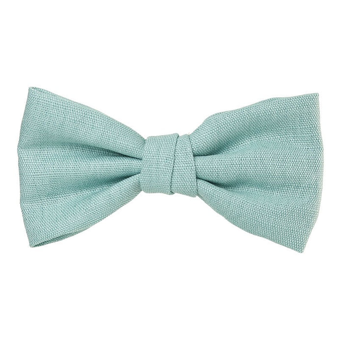 Beautiful and classic Linen bow in an alligator hair clip. This bow adds a perfect touch to any outfit! Timeless design a must have! Handmade in Spain. Olivia Ann Wholesale Accessories.