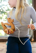 A walk-a long toy is the best toy for those who have already learned to walk. Is comfortable to hold by the smooth wooden handle. This sweet duck is made of solid beech.  Educational Montessori Toy.