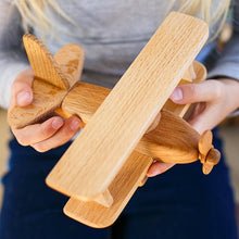 This beautiful wooden airplane is it is made of natural wood (oak and beech). Montessori organic toy. This original design plane is a perfect birthday gift idea for boys & girls or wooden toys collectors.