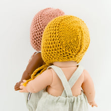 This cosy bonnet is hand knitted in Europe, specially designed for the 34 cm dolls, but can fit dolls around 32 - 38 cm (12 - 15 inch) Miniland, Minikane, Paola Reina Gordis and similar. 
