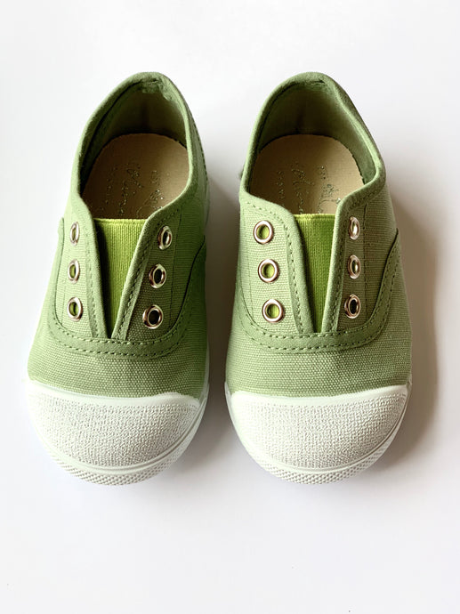 Our OLIVIA ANN soft canvas shoes have a new and improved material that is supersoft and comfortable, and perfect for speedy slip-ons when there's a game in the garden. Plimsoles, sneakers. Kids shoes. Olive. Green