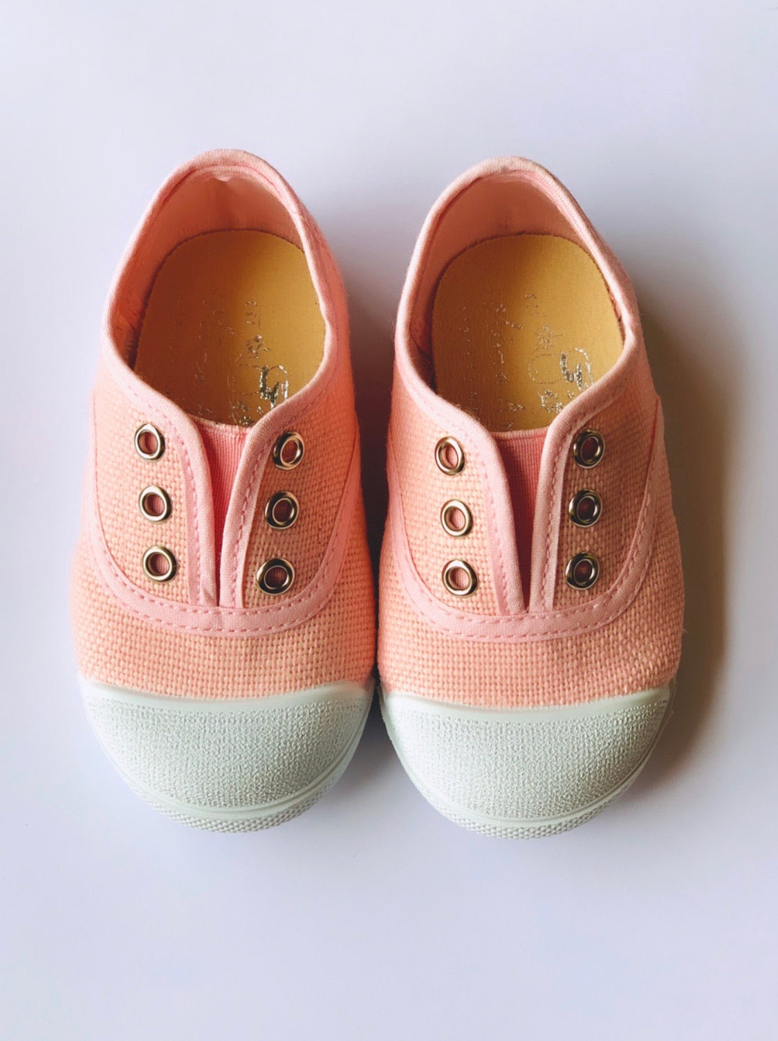 Our OLIVIA ANN soft canvas shoes have a new and improved material that is supersoft and comfortable, and perfect for speedy slip-ons when there's a game in the garden that can't wait.  Sneakers. Plimsoles