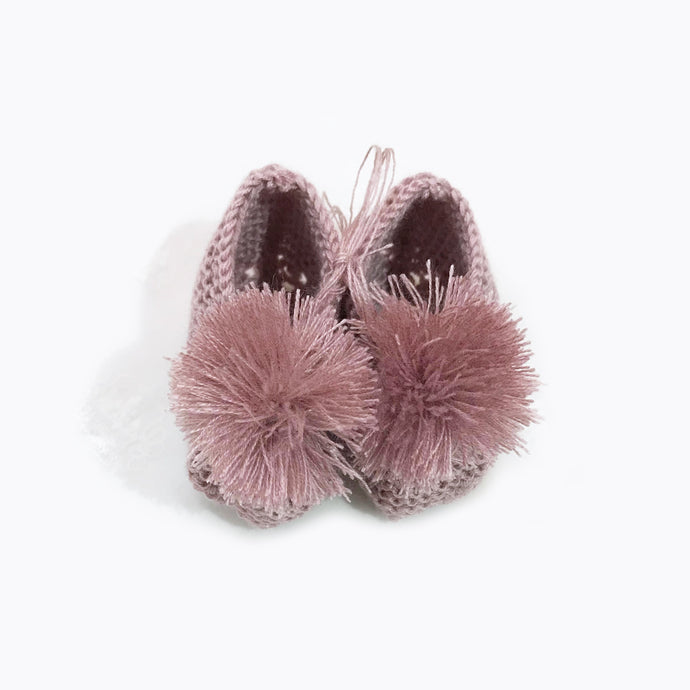 The cutest tiny baby hand knitted shoes. 